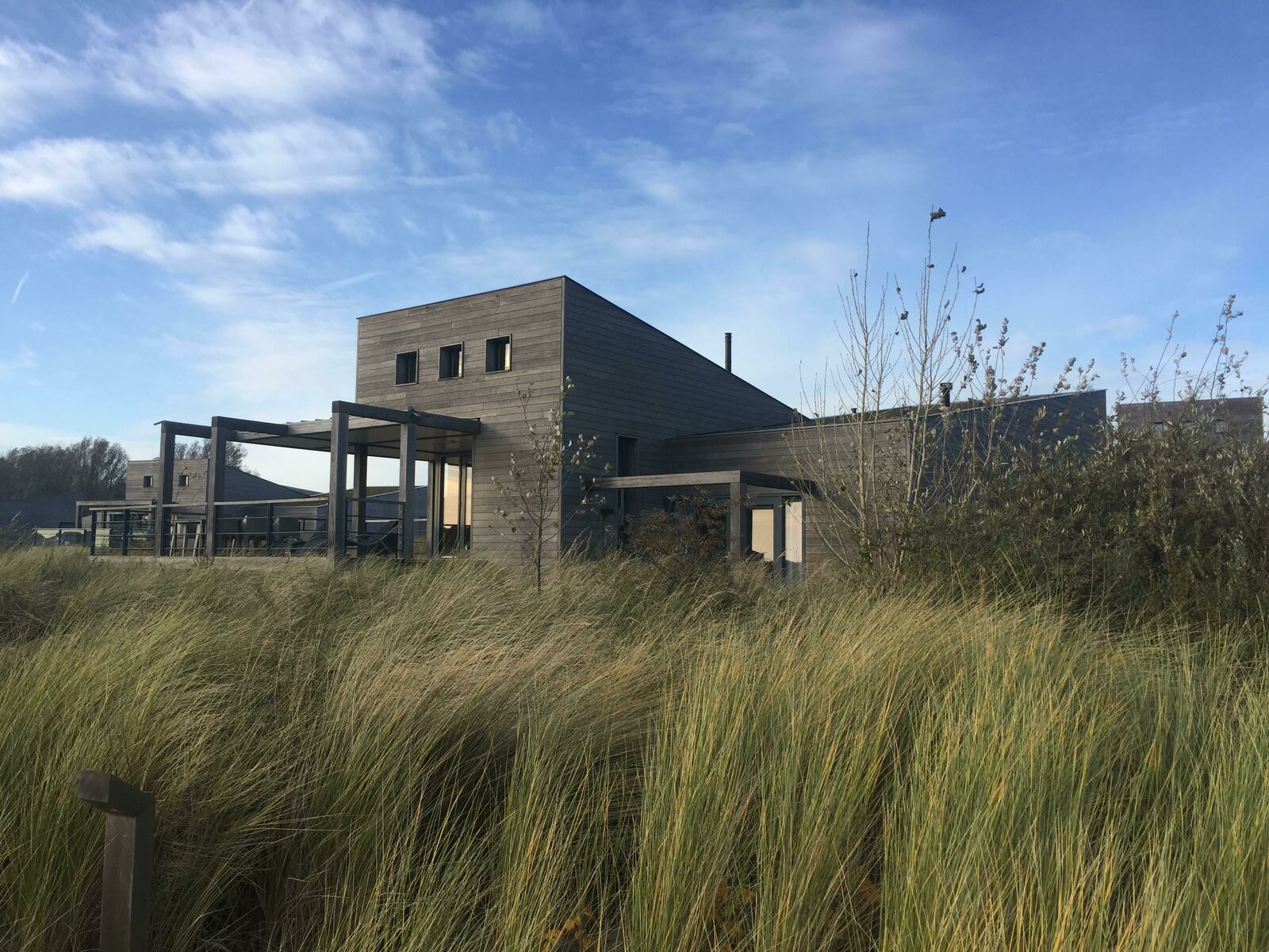 The villa was completely lost in the dunes and grass. The villa was completely lost in the dunes and grass